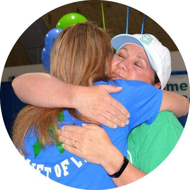Be There for Patients & Families. Mid-America Transplant employee hugs a donor family member.