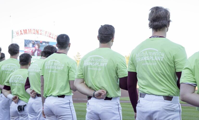 Missouri State baseball players in green shirts