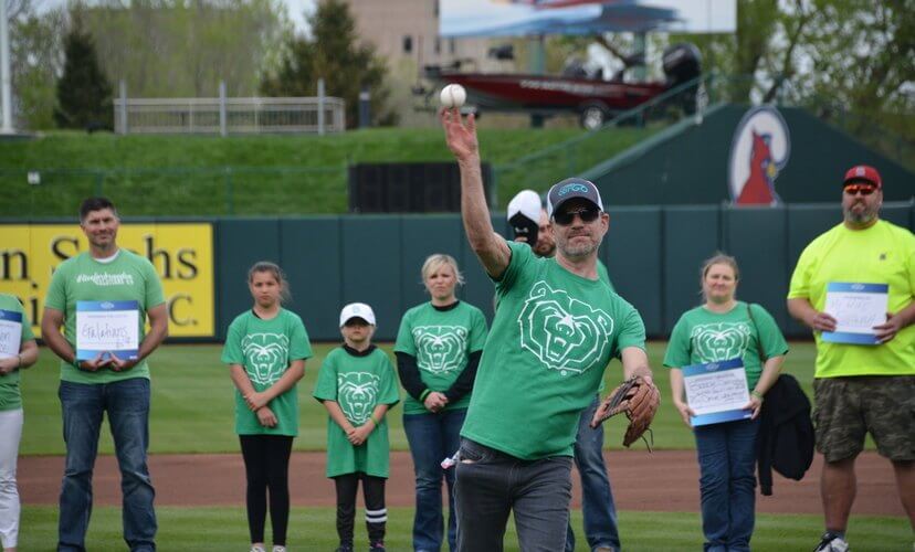 Dave Colbe throws the first pitch at the Missouri State baseball Green Up Game.