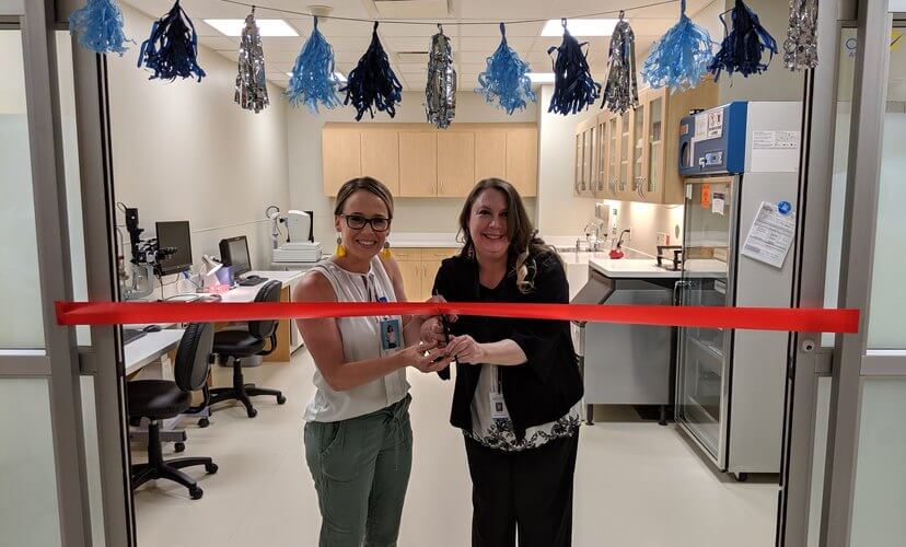 Ocular coordinato r Savannaha Wiley, left, and lead ocular coordinator Kristene Clark official open the new Mid-America Transplant Eye Bank.