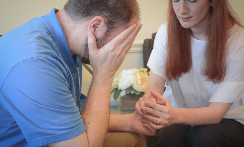 A person supporting another in grief.