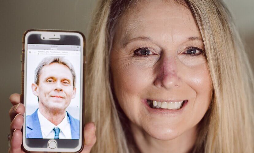 Kelley Pendleton holds up a picture of her late husband Kevin, who became an organ donor