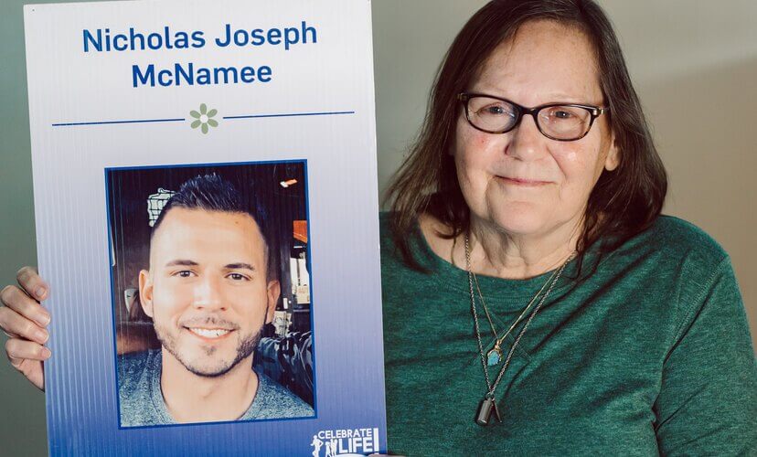 Peggy Stover holds a photo of her organ donor, Nick.