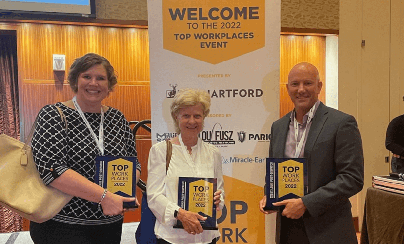 Members of Mid-America Transplant leadership stand with plaques that read "Top workplaces 2022"