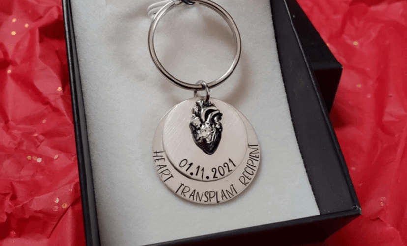 Keychain with an embossed anatomical heart and the date of Darren's transplant