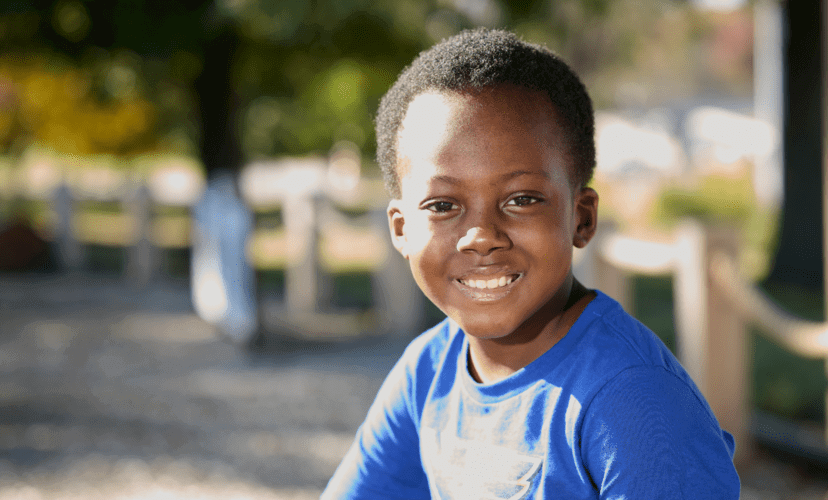 7-year-old Lakevious smiles at the camera