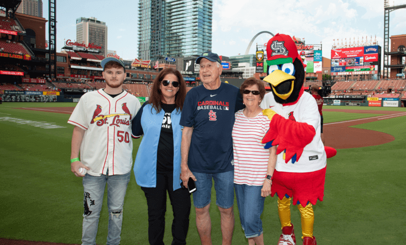 Transplant survivor tosses first pitch at Cardinals game