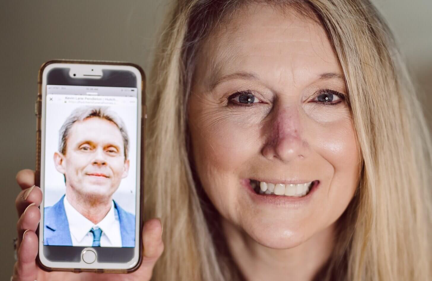 Kelley Pendleton holds up a picture of her late husband Kevin, who became an organ donor