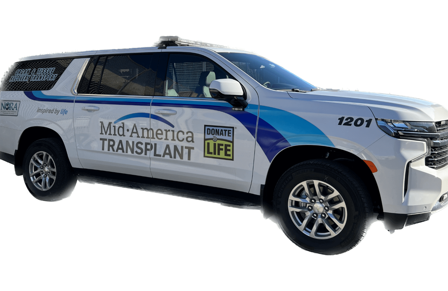 An SUV decorated with the Mid-America Transplant and Donate Life logos.