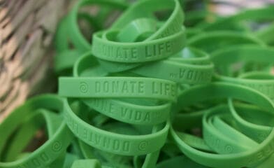 A basket of green bracelets