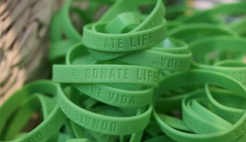 A basket of green bracelets