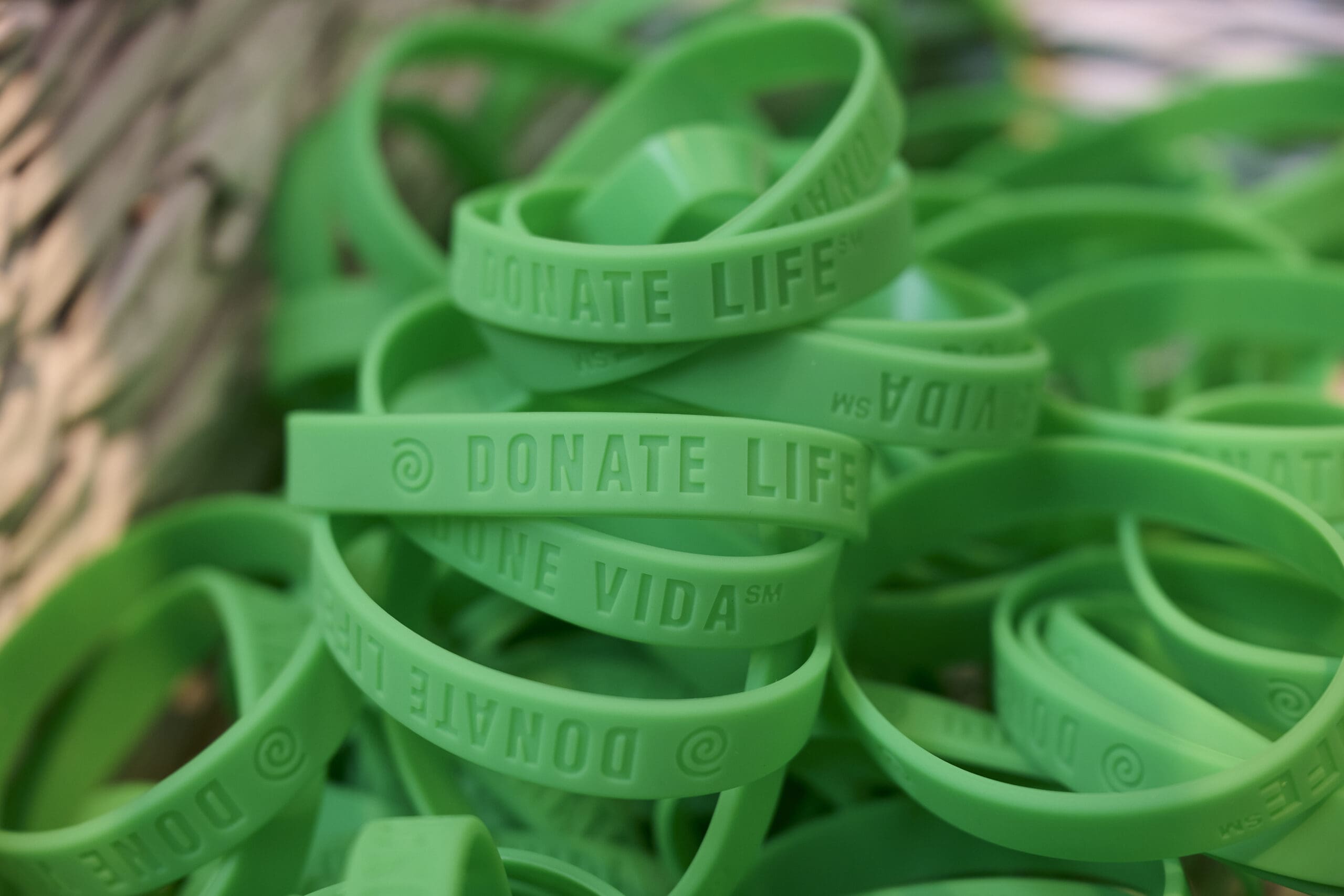 A basket of green bracelets