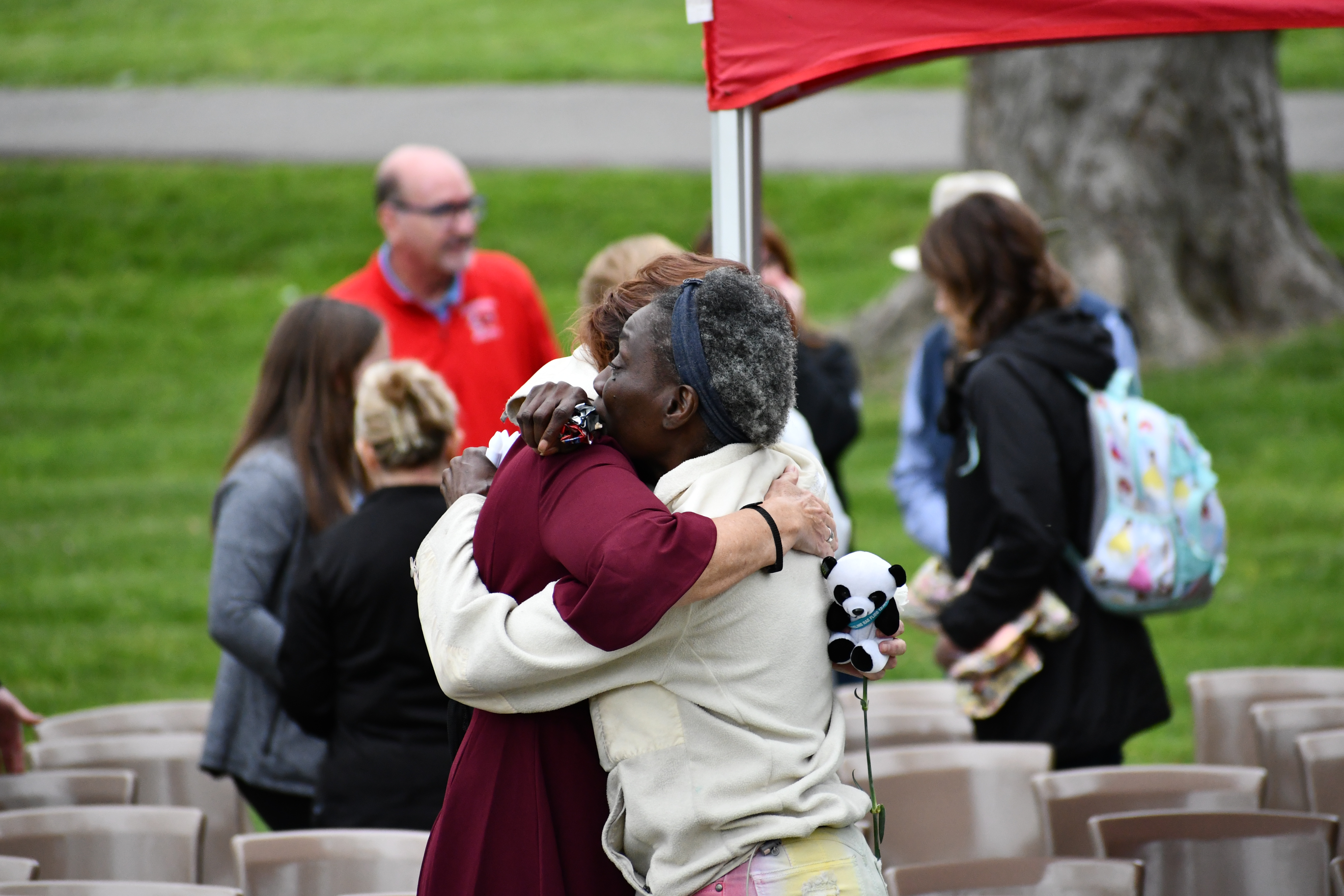 Employees line the halls to honor an organ donor as they are taken to the OR